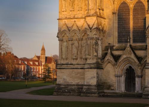 a building with statues on the side of it at Sarum College in Salisbury
