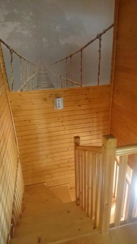 a wooden staircase in a room with a wooden wall at Villa L'Epicléa, Chorges, entre lac et montagnes in Chorges