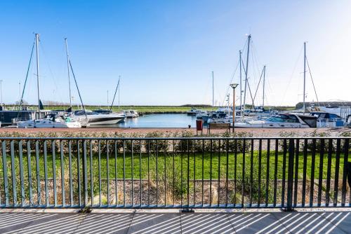 a view of a marina with boats in the water at Luxe appartement in haven Marina Kamperland - 2 badkamers in Kamperland