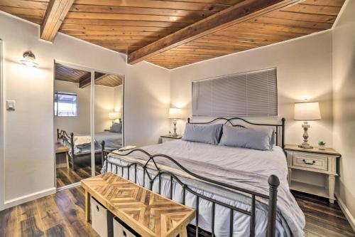 a bedroom with a large bed with a wooden ceiling at Comfortable Home about 2 Mi to Reno Riverwalk in Reno