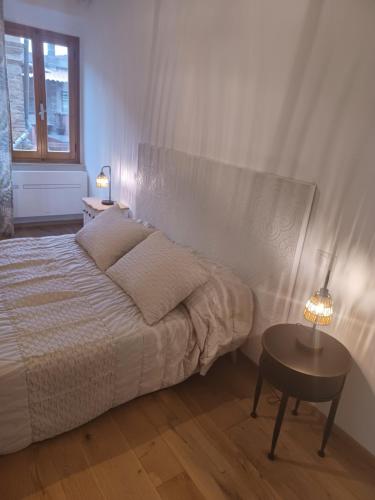 Postel nebo postele na pokoji v ubytování CASA NELLA Appartamento nel Centro Storico