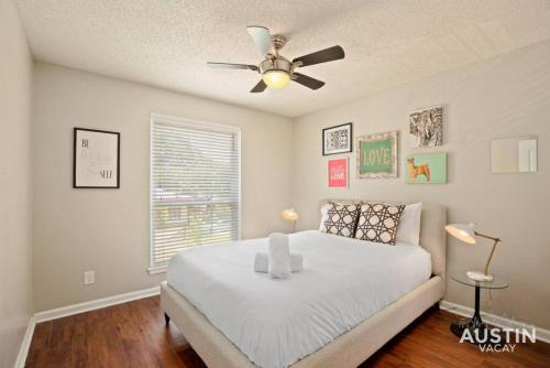 a bedroom with a bed and a ceiling fan at Austin East Side on Manor Rd in Austin