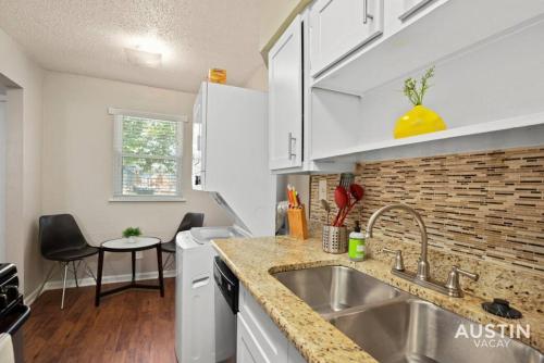 a kitchen with a sink and a counter top at Austin East Side on Manor Rd in Austin