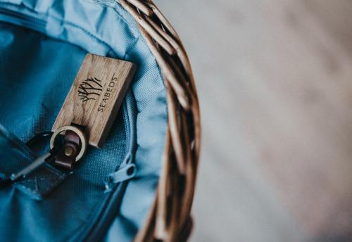 a close up of a zipper of a blue backpack at SeaBeds - Luxury Lookouts with Hot Tubs in Glencoe