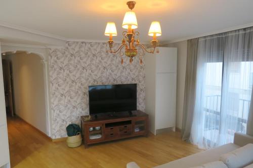 a living room with a flat screen tv on a wall at Apartamento Calle San Isidro 1ºA in Ezcaray