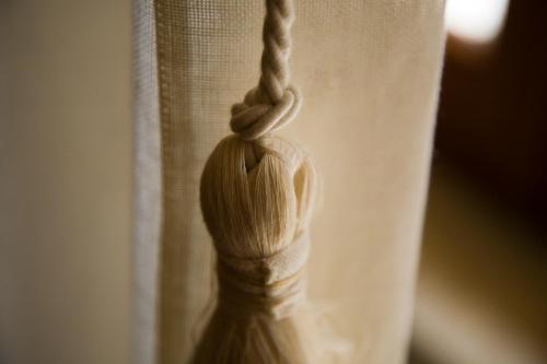 a white curtain with a knot in the middle at VILLA EVA in Sirolo
