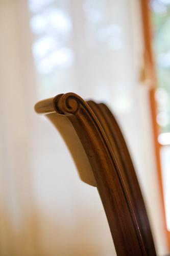 a close up of the back of a wooden chair at VILLA EVA in Sirolo