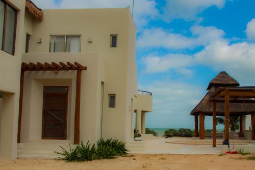 a building in the desert with a gazebo at Villa Karpatos in Progreso