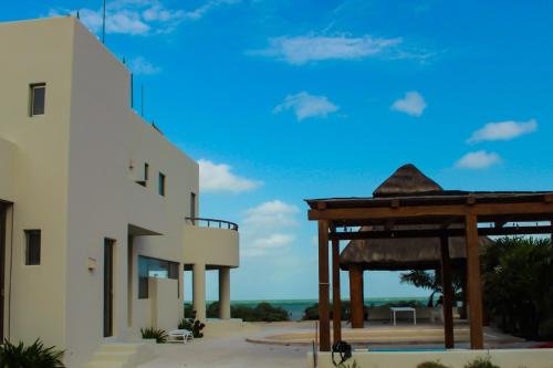 a rendering of a building and a gazebo at Villa Karpatos in Progreso