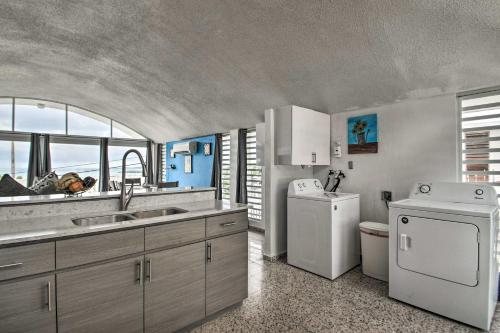 a kitchen with a sink and a washing machine at Peaceful Puerto Rico Paradise with Views and Balcony in Fajardo