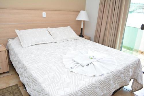 Cama ou camas em um quarto em Hotel e Restaurante Canta Galo