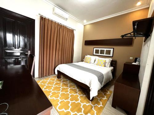 Krevet ili kreveti u jedinici u objektu Avila Ketapan Rame Hotel