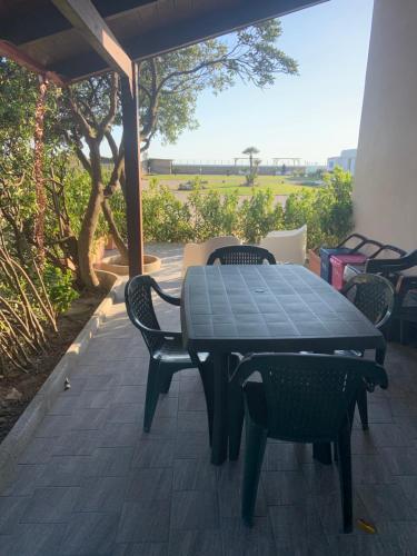 a black table and chairs on a patio at Edoardo e Franca in Minturno