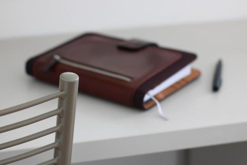 a brown purse sitting on top of a table at PIUMABLU in Campi Bisenzio