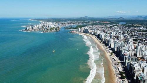 an aerial view of a beach and buildings at Pousada Paraiso Guarapari in Guarapari