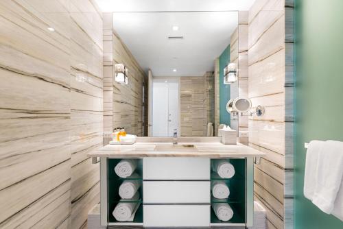 a bathroom with a sink and a mirror at Ocean View Residence at W South Beach -1226 in Miami Beach