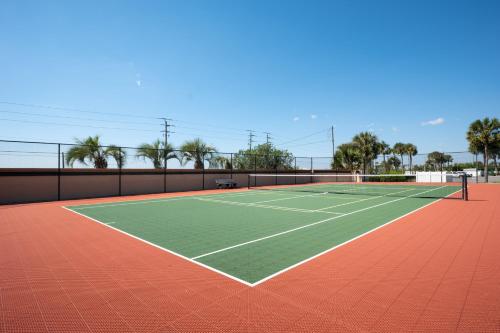 a tennis court with two tennis courts at Windjammer 403 in Cedar Landing