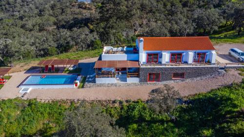 an aerial view of a house with a swimming pool at Sierra Melides Villa,Alentejo, BR2 with private pool, BR3 with private pool - near beach in São Francisco da Serra
