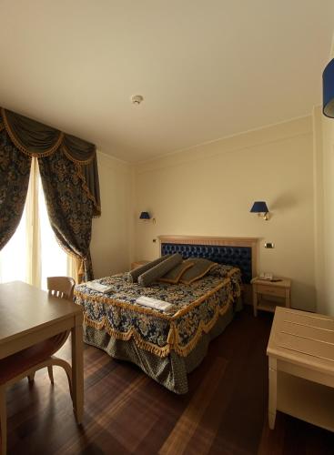a hotel room with a bed and a window at HOTEL CONCORDE in SantʼEgidio alla Vibrata