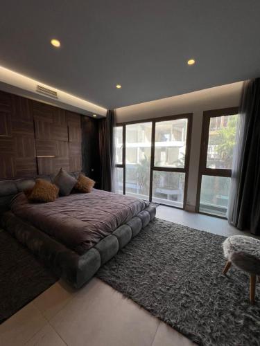 a bedroom with a large bed and a rug at Luxury apartment in Casablanca in Casablanca