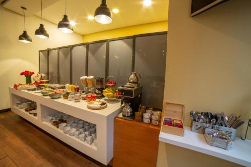 a buffet line with food on display in a restaurant at Hotel Espacio 94 in Bogotá