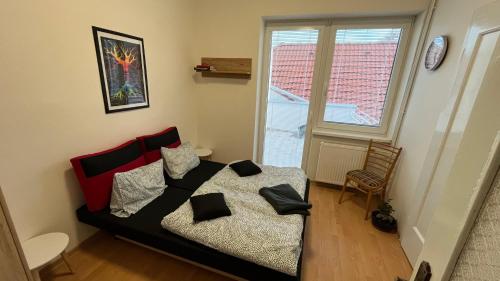 a bedroom with a bed with pillows on it at V srdci mesta in Stará Turá