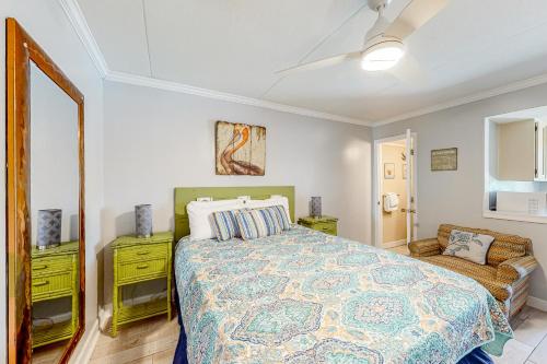 a bedroom with a bed and a couch at Beachview 204 in Gulf Shores