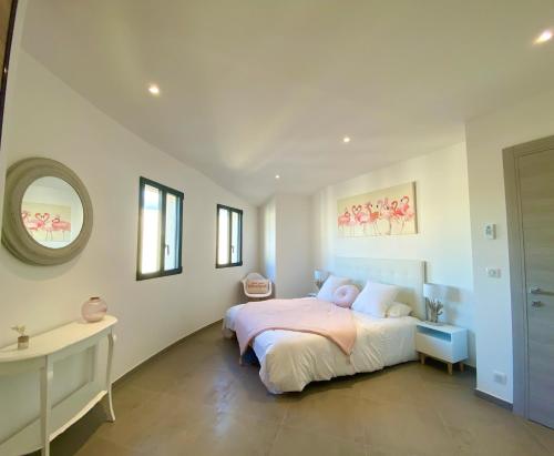 Ένα ή περισσότερα κρεβάτια σε δωμάτιο στο Casa u fornu Residence & Spa