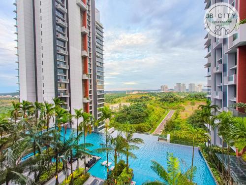 an overhead view of a pool between two buildings at Grand Medini by JBcity Home in Nusajaya