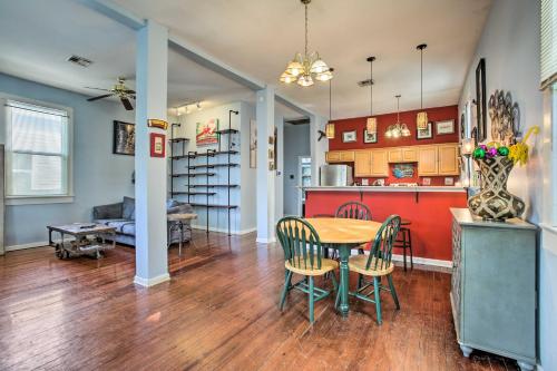 a kitchen and living room with a table and chairs at 5 Mi to Bourbon Street Central NOLA Home in New Orleans