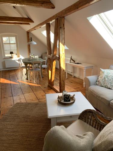 a living room with a couch and a table at Residenz Moselliebe in Traben-Trarbach