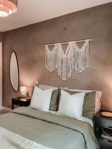 a bedroom with a large bed with a chandelier at Stylish 1Bed Apartment in Sheffield CC in Sheffield