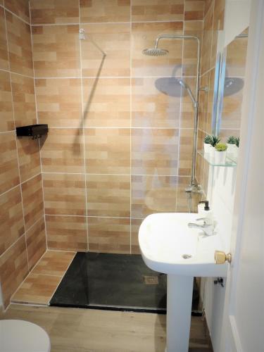 a bathroom with a shower and a sink at Mi Lugar FTV in Corralejo