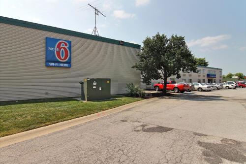 a building with a sign on the side of it at Motel 6-Merrillville, IN in Merrillville