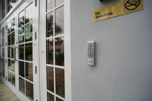 a door with a sign that says no smoking on it at The Julia Hotel in Miami Beach