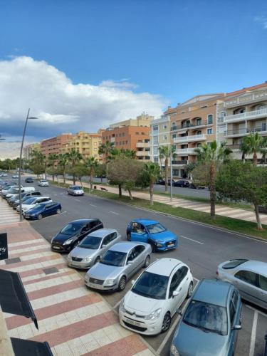 a bunch of cars parked in a parking lot at Piso luminoso cerca de la playa in Roquetas de Mar