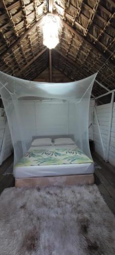a mattress in a room with a ceiling at Saona lodge in Mano Juan