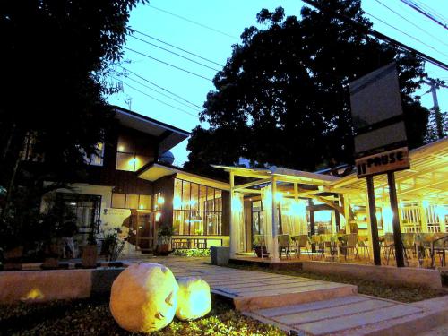 a building with two large balls in front of it at Chiang Mai D Hostel in Chiang Mai