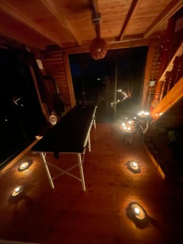 a room with a table and a fireplace with lights at Mi lugar secreto in Medellín