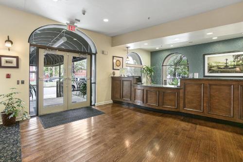 an empty lobby with an entrance to a restaurant at St Charles Inn, Superior Hotel in New Orleans