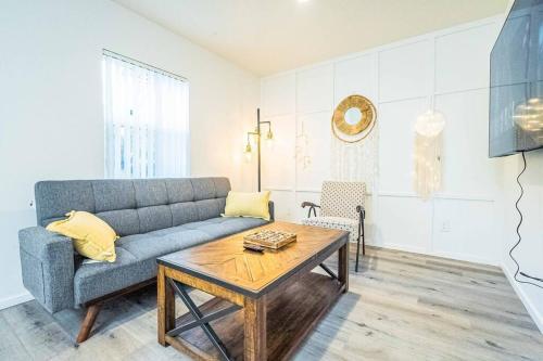 a living room with a couch and a coffee table at Stylish 2B2B country style house in Glendora