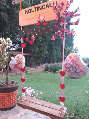 a sign that says kothinatal with hearts on it at Koltincalli in Xico