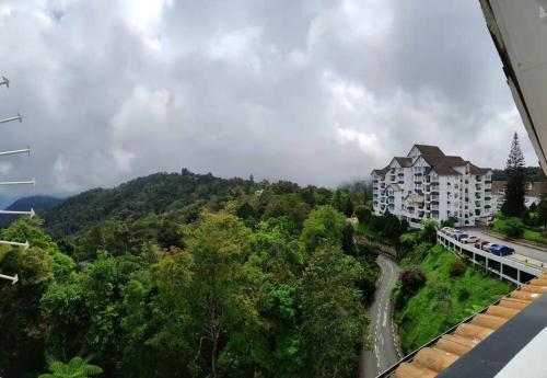 a view of a building on a hill with trees at Fraser Hill Silverpart Resort B2-6-1 Forest View High Floor No Lift in Bukit Fraser