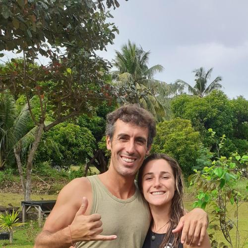 a man and a woman posing for a picture at House of TamSe Laagans ' Inn in Badian