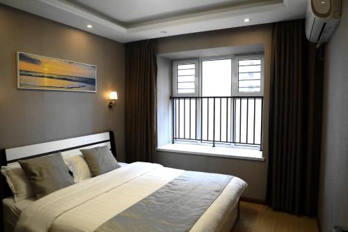 Fotografie z fotogalerie ubytování Sea View Apartment Qingdao North Railway Station Branch v destinaci Xiazangtuan