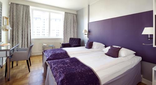 Un ou plusieurs lits dans un hébergement de l'établissement Home Hotel Bastion