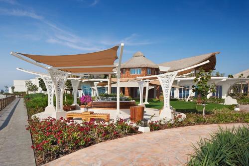 a house with a gazebo and flowers at Banana Island Resort Doha by Anantara in Doha