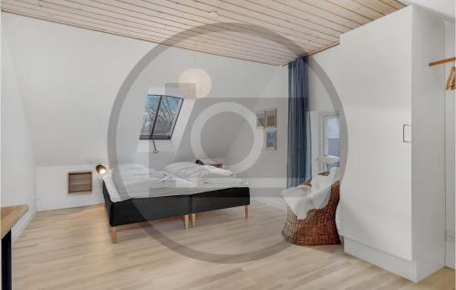 a bedroom with a bed and a large mirror at Cozy Home In Nrre Nebel With Wifi in Nørre Nebel