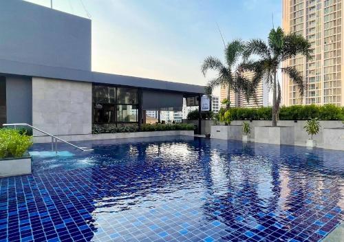 a swimming pool in the middle of a building at Eleven Hotel Bangkok Sukhumvit 11 in Bangkok