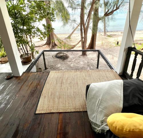 a screened porch with a view of the beach at BEACH BUNGALOW - OUTDOOR net on the beach - Working Desk in Lipa Noi